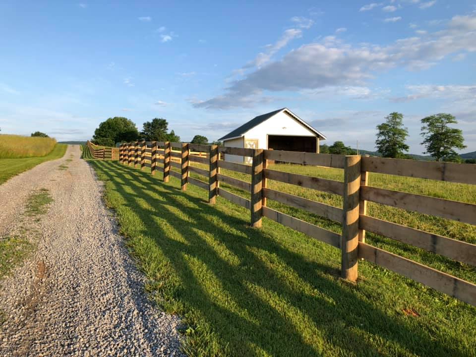 Photo of a 4-board farm fence in Mid-Atlantic region